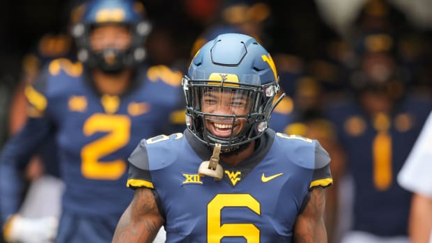 West Virginia Mountaineers safety Dravon Askew-Henry (6) runs out of the tunnel before their game against the Youngstown State Penguins at Mountaineer Field at Milan Puskar Stadium.